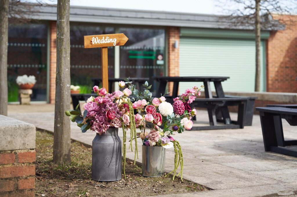 Clifton Park Garden House decorated for a wedding with floral arrangements and elegant table styling