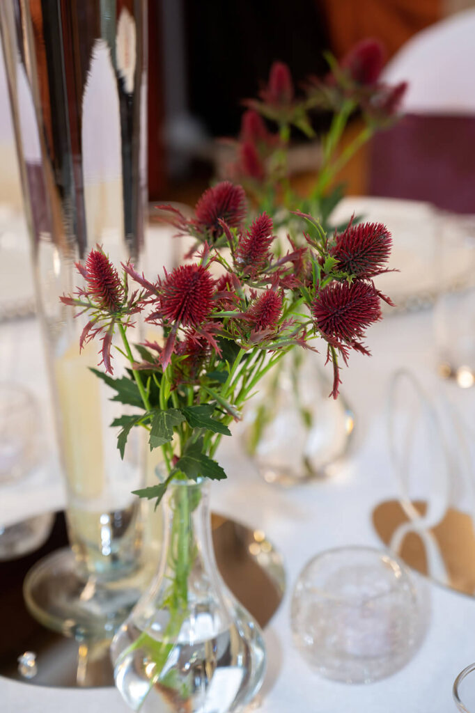 Affordable wedding decor in Yorkshire with DIY rustic touches - wooden pallet signs, wildflower centerpieces, and hessian table runners.