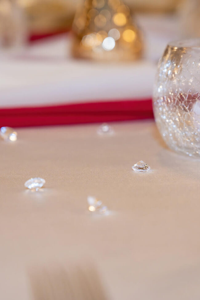 Clear cracked glass tealight candle holder with tealight on an event table