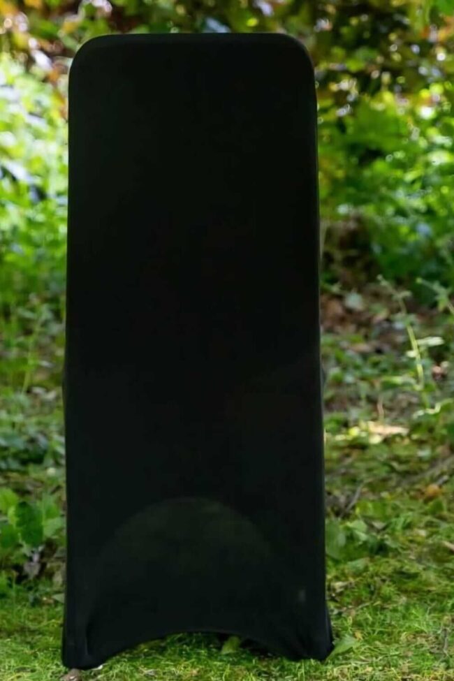 Black stretch chair covers for hire fitted neatly on a banqueting chair