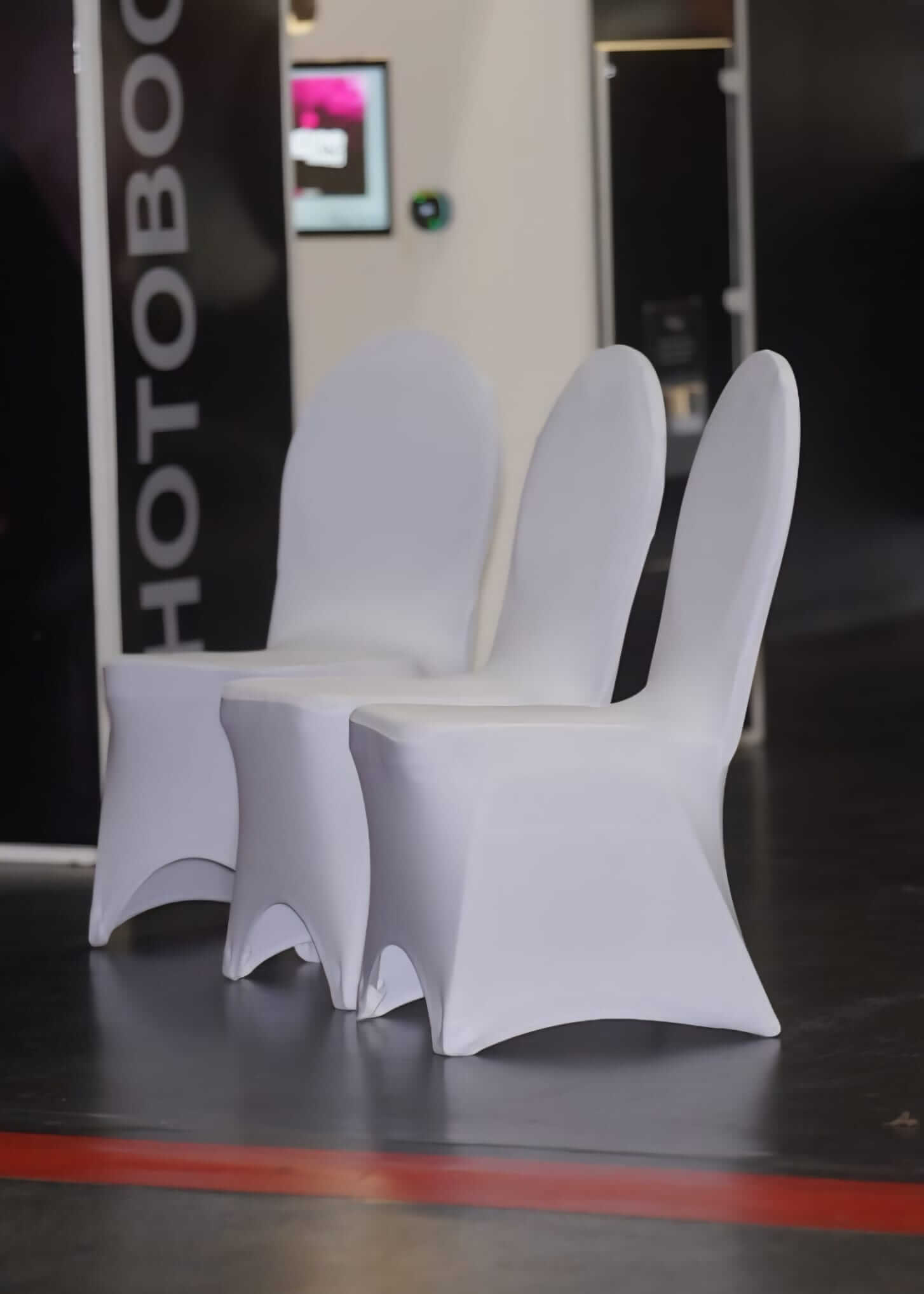 White chair covers for hire at an event venue
