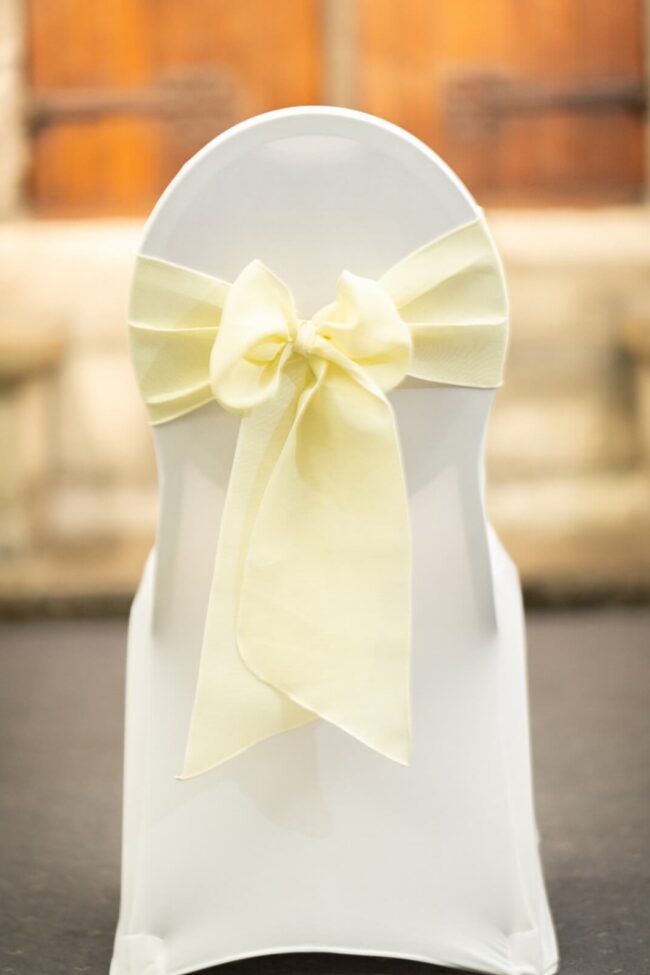 Cream chair sash tied in a centred bow
