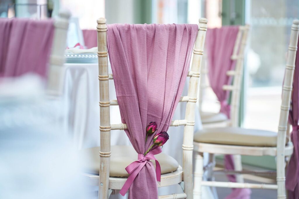 blush pink drape for chairs in cheesecloth on a chiavari chair