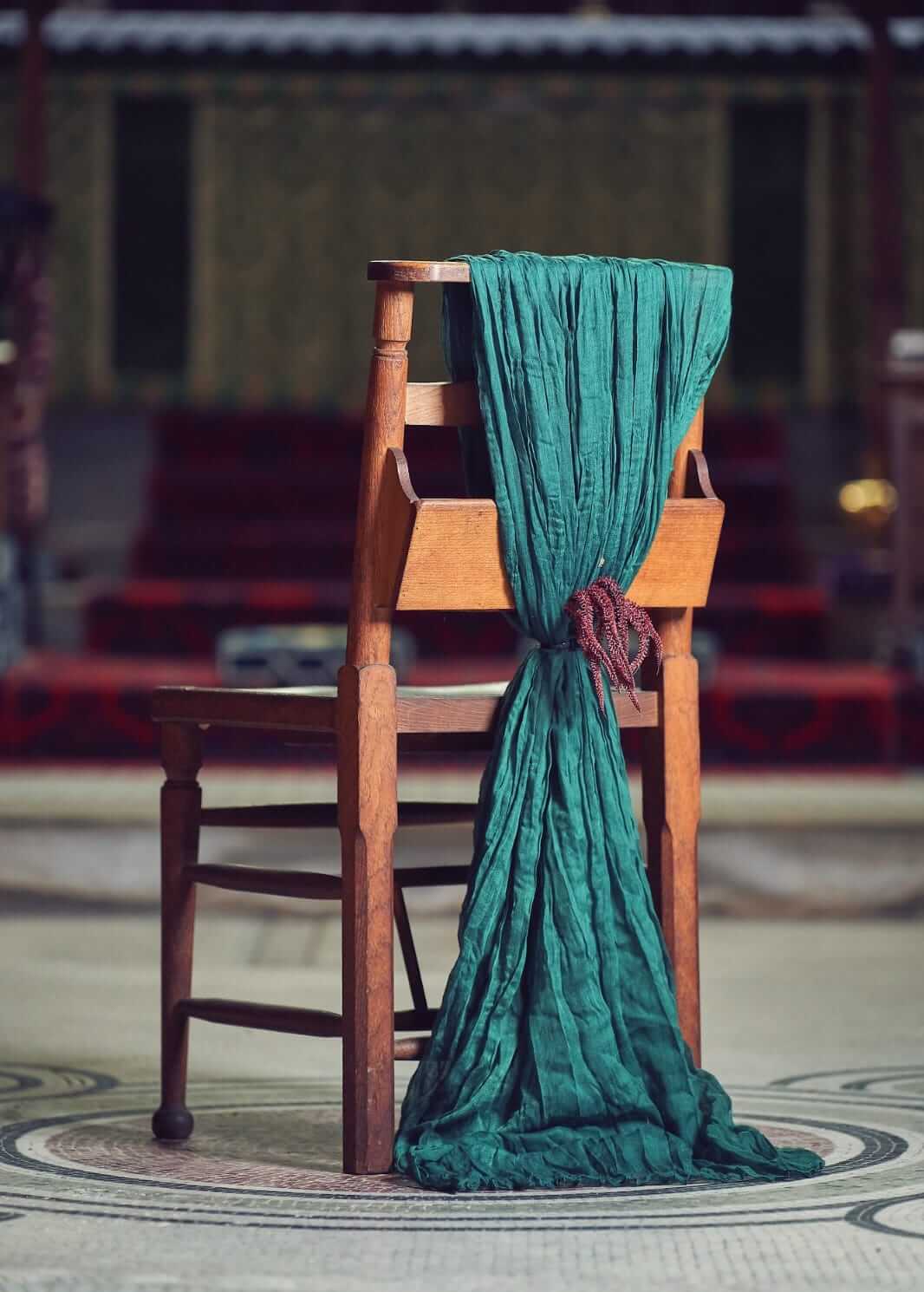 Green chair drape for hire styled in a long textured drop