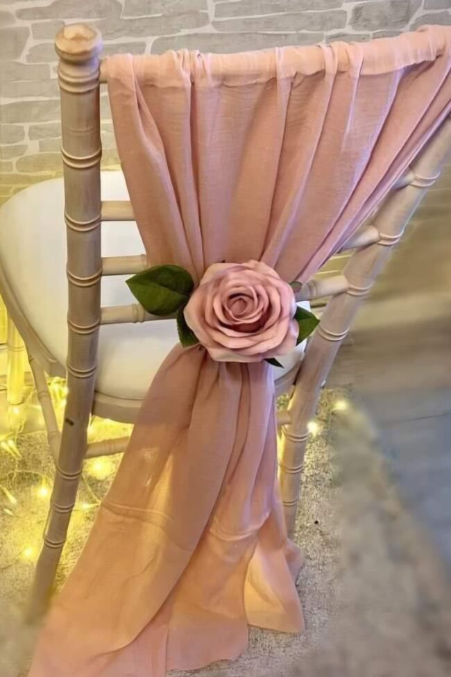 Blush pink chair drape for hire styled on a Chiavari chair
