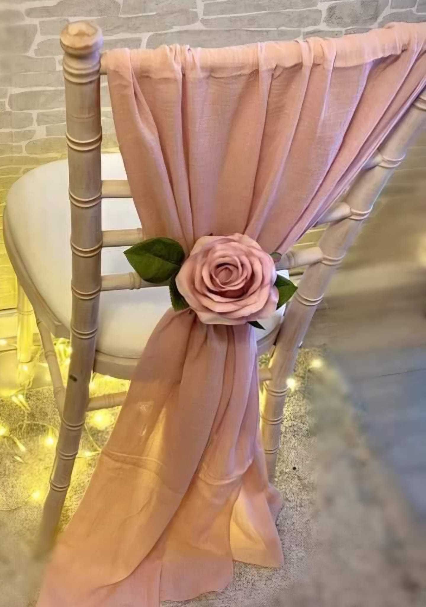 Blush pink chair drape for hire styled on a Chiavari chair