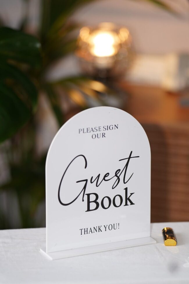 Acrylic sign for guest book for wedding stationery table