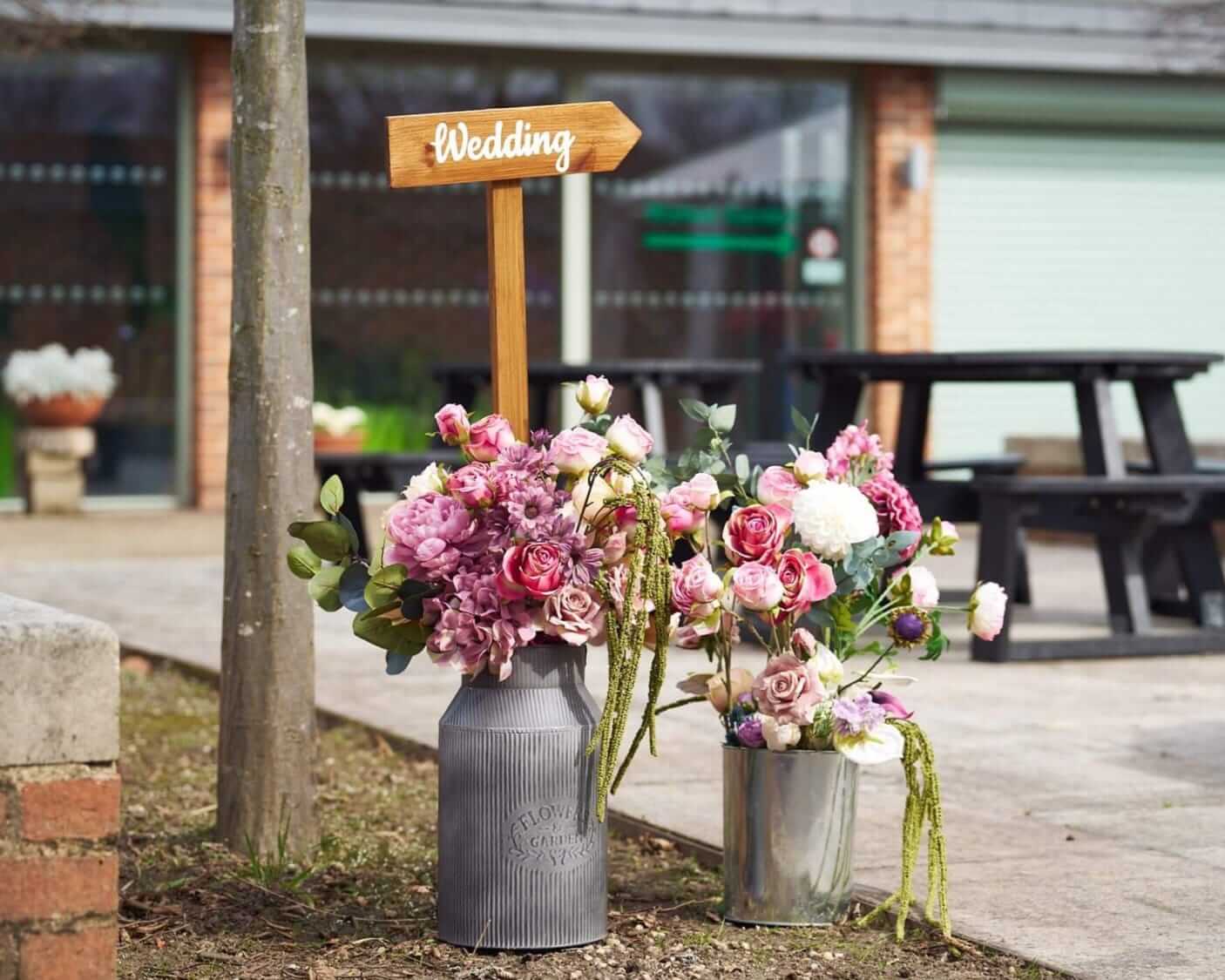 Direction signs for events guiding guests to the wedding