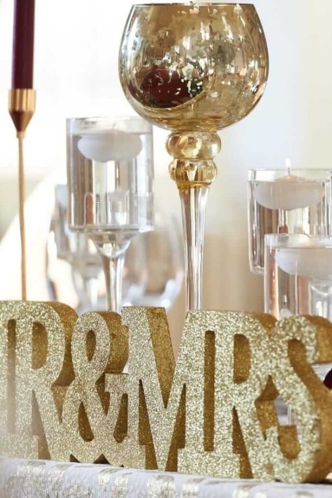 mr and mrs top table sign styled with candle holders