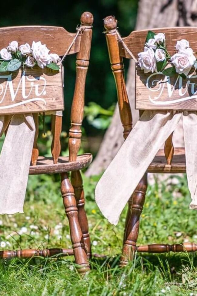 mr and mrs seat signs styled for an outdoor ceremony