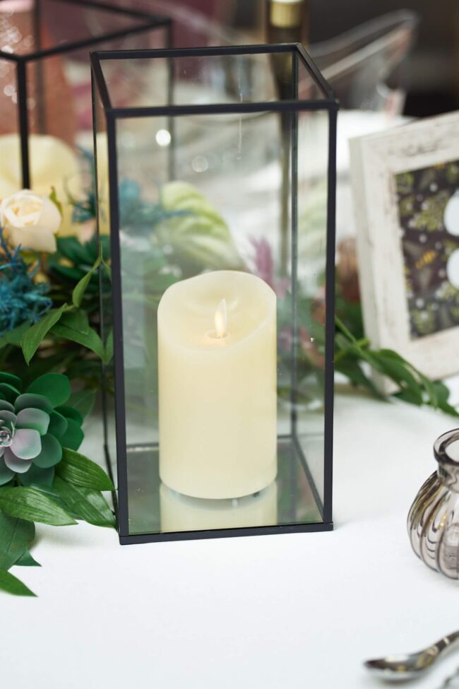 Black Metal Hurricane Lamp Candle Holder with glass panels and LED pillar candle