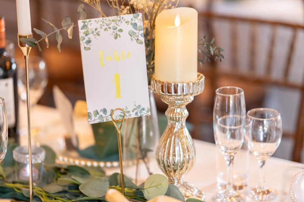Flameless pillar candle on silver pedestal for warm table glow