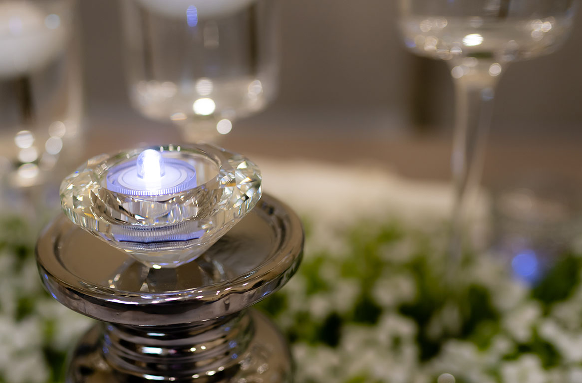 Silver mercury glass pillar candle holders close-up with LED light