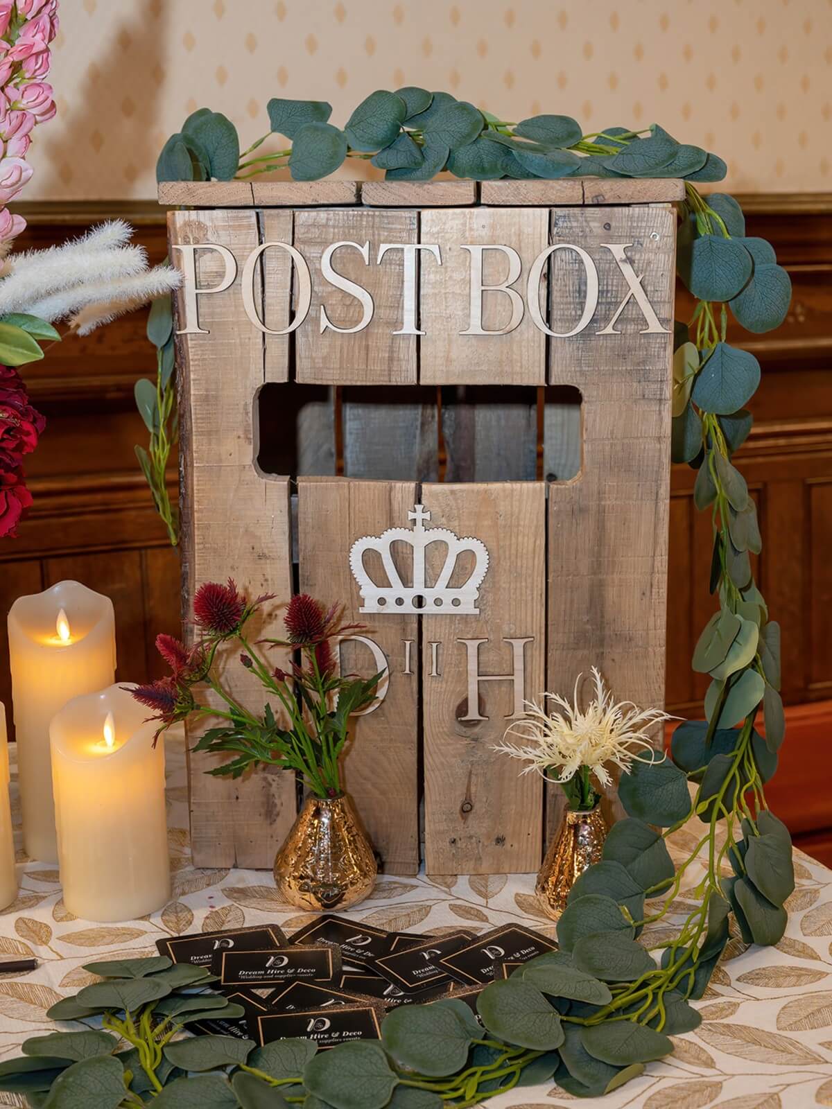 Wedding postbox front view of wooden post box with greenery styling
