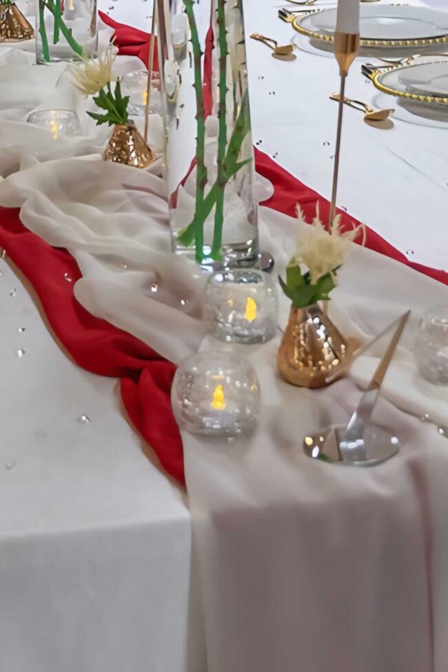 Cream table runner in 4m chiffon styled along the centre of a dressed event table