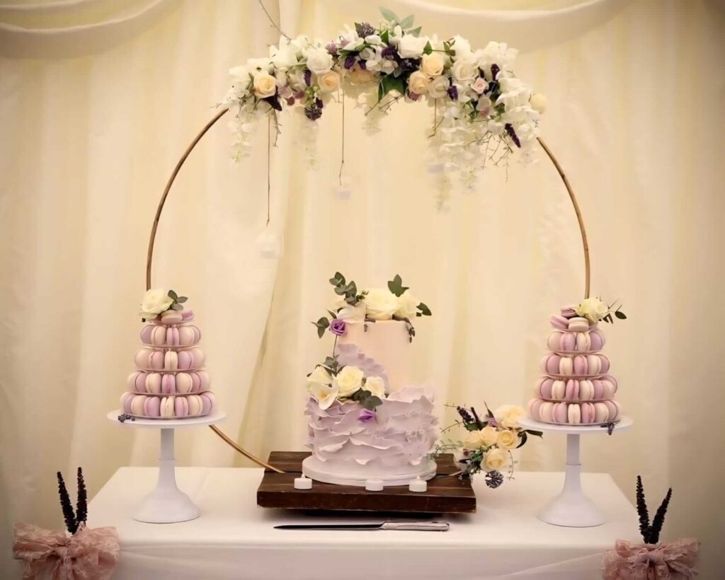 wedding cake hoop stand hire behind a cake table display