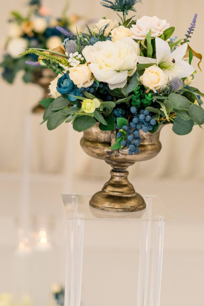 Short artificial flower arrangement styled for wedding and event tables