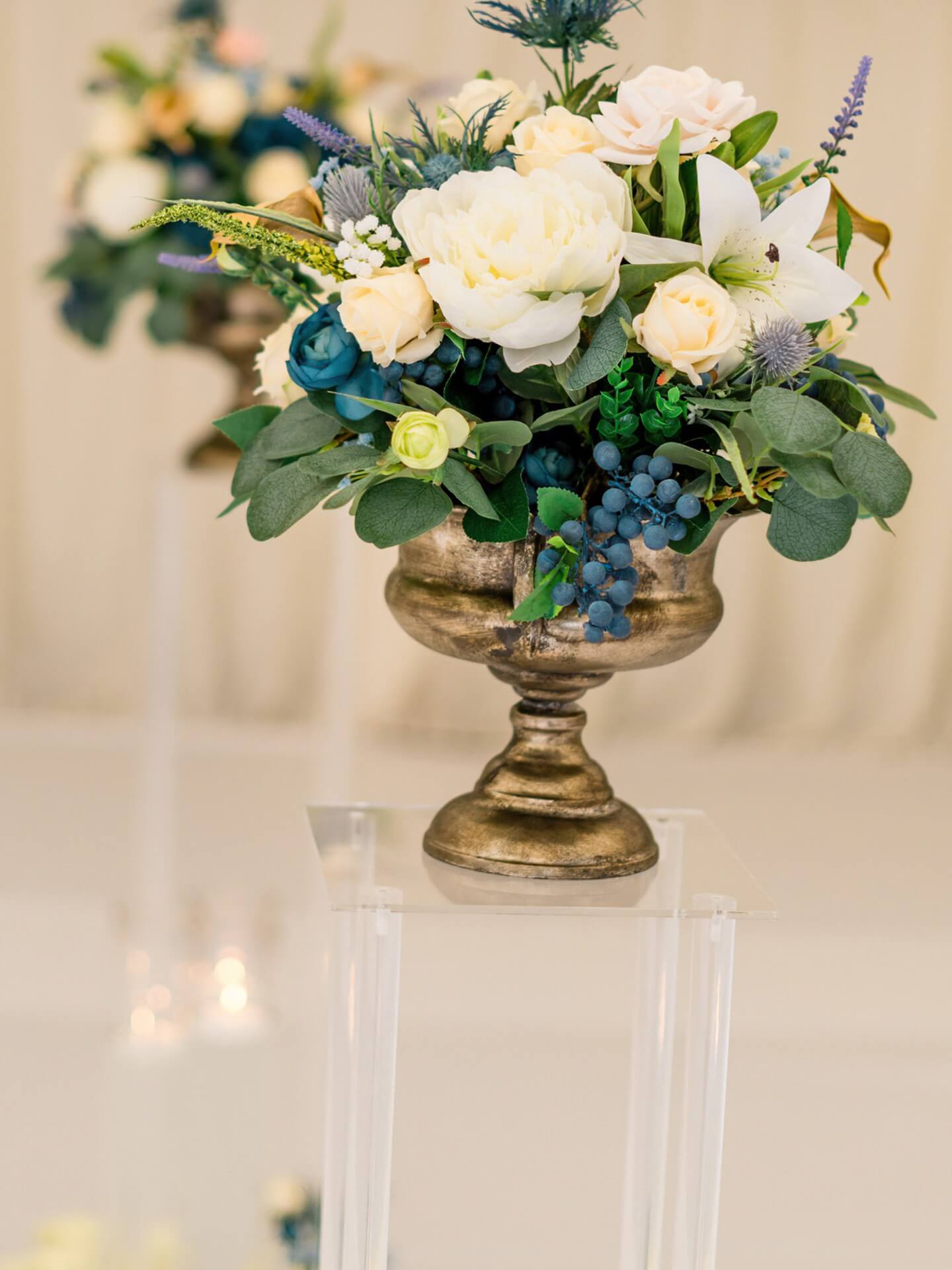 Short artificial flower arrangement styled for wedding and event tables