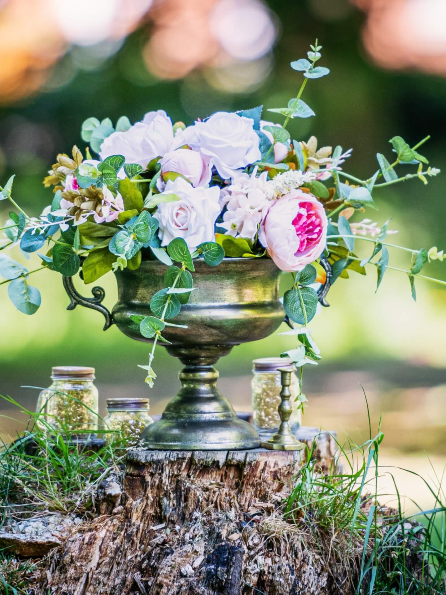 Artificial flower centrepiece with a low bespoke floral design for event styling