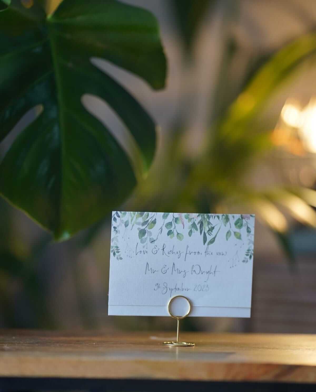 Wedding card holders displaying a printed name card for guest table styling