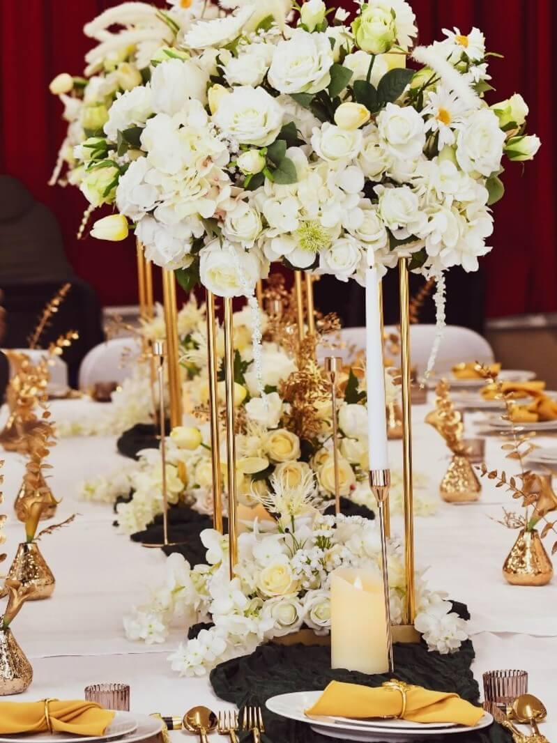 Gold table flower stand supporting a raised display