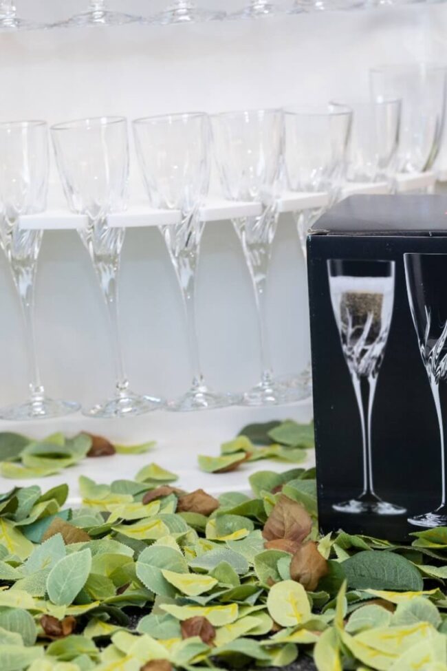 RCR flute glasses displayed beside their branded packaging