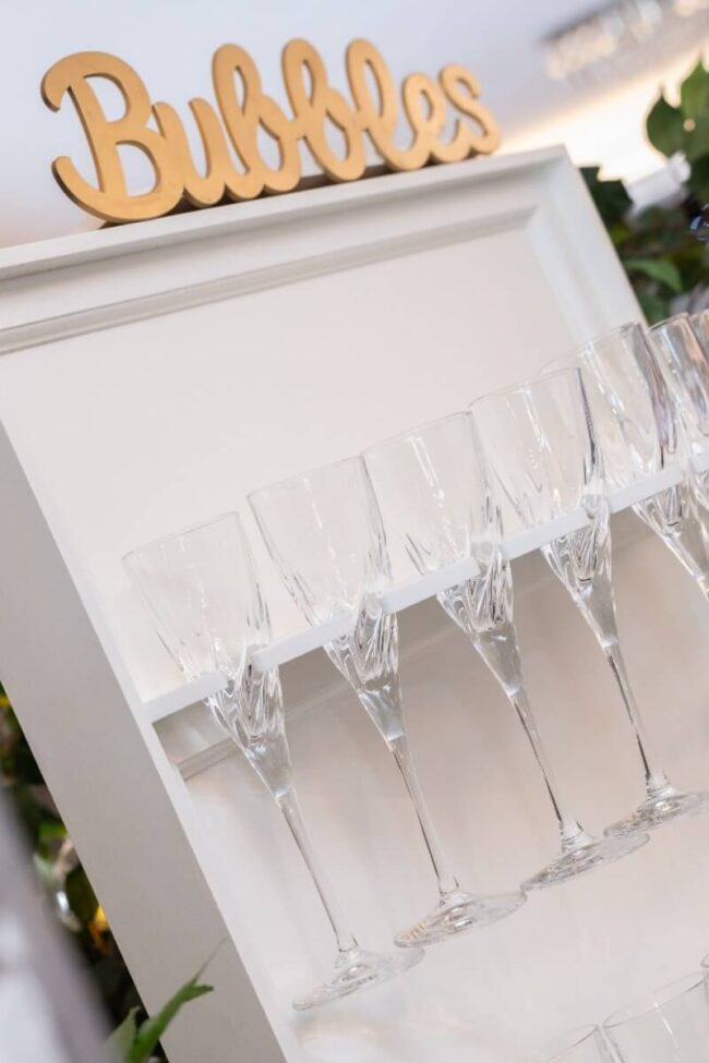 RCR champagne flutes arranged on a drinks display