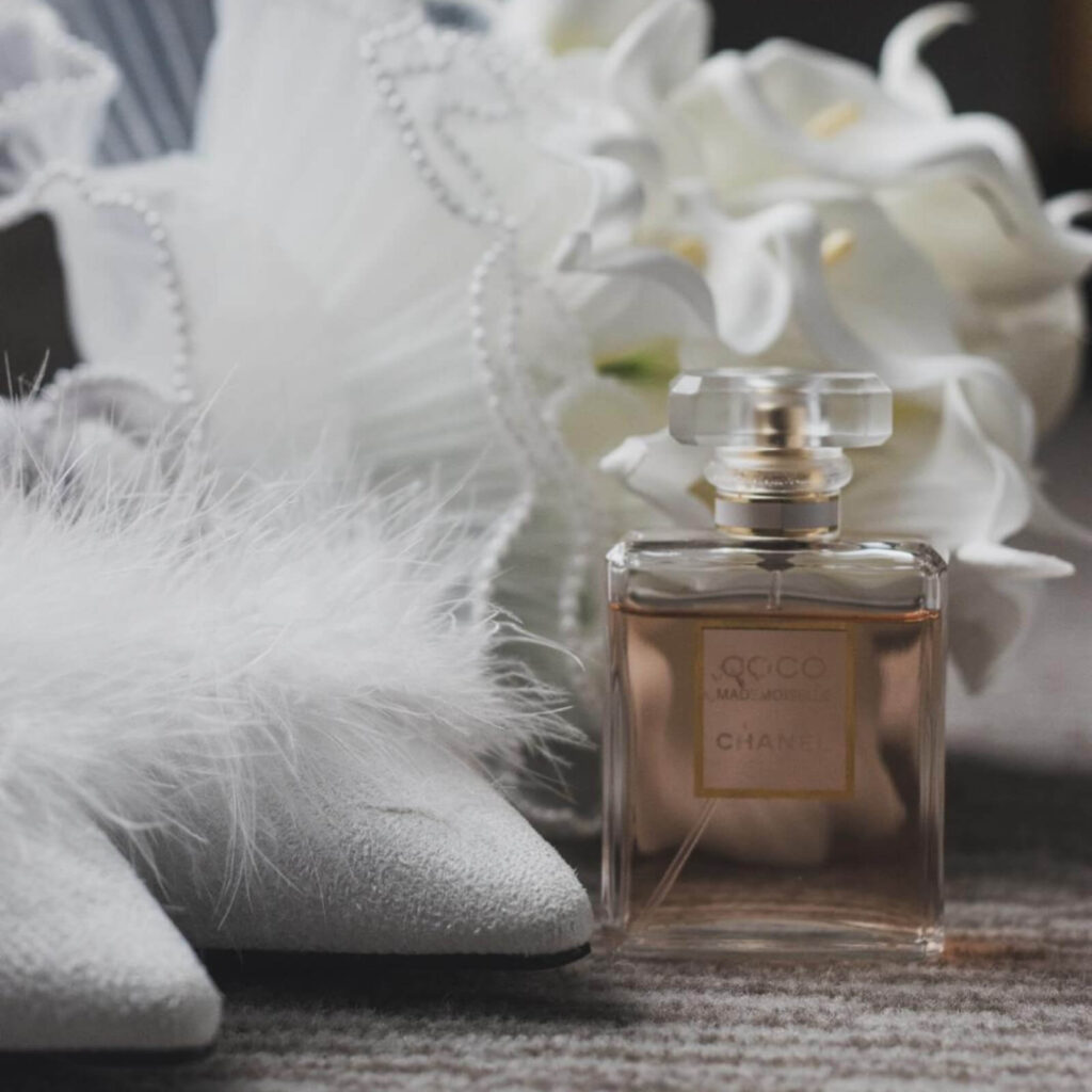 Bridal accessories inspiration with perfume, heels, and details