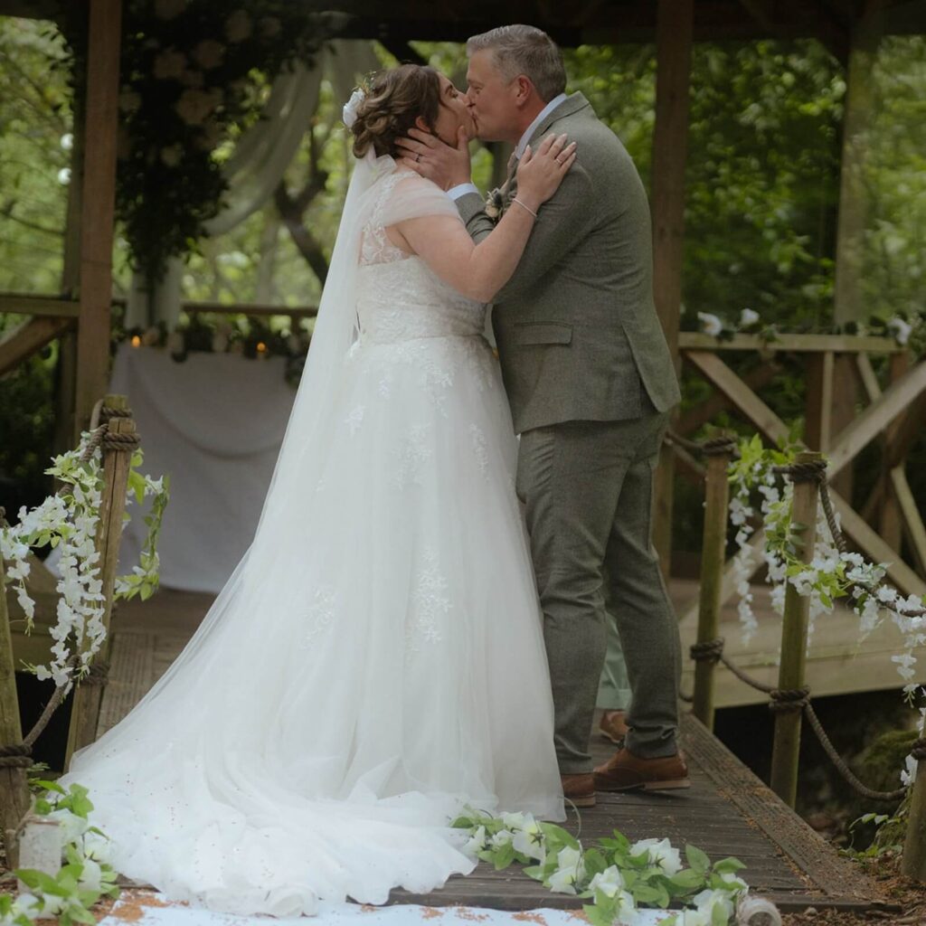 Couple exchanging vows in a romantic wedding ceremony setup