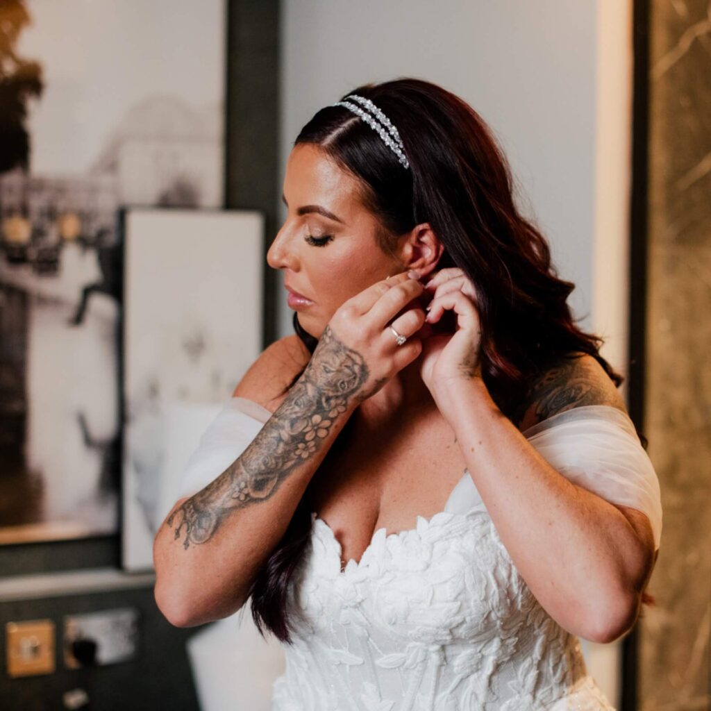 Bride posing gracefully in elegant wedding dress styling