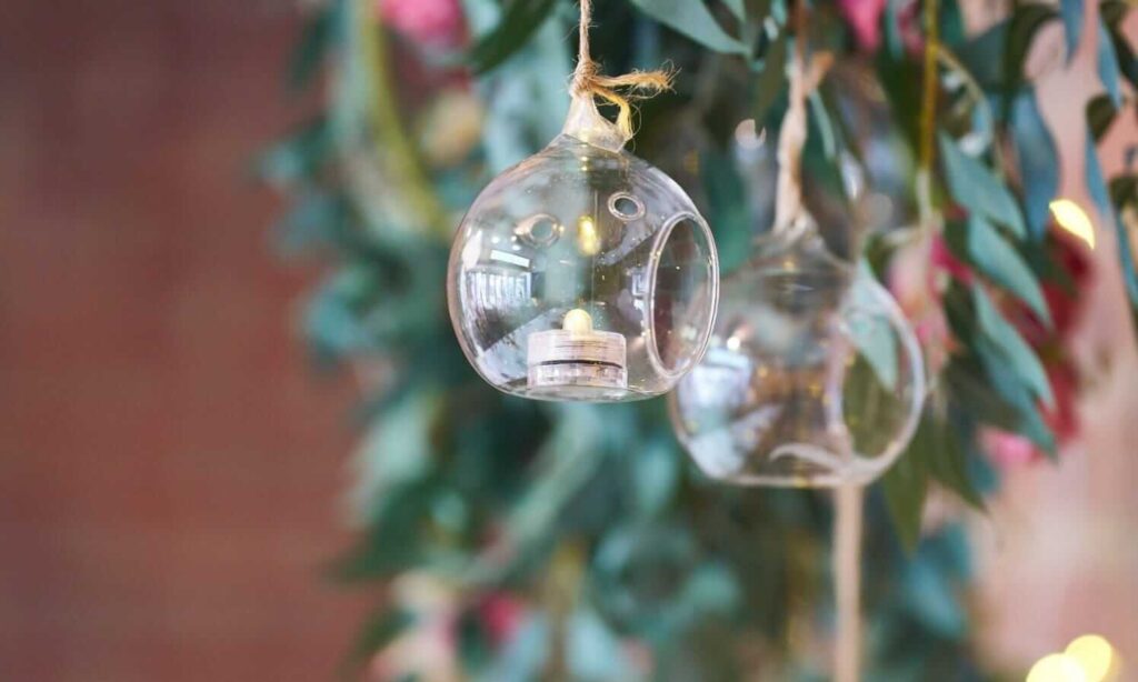 Glass hanging candle bauble for a rustic wedding backdrop.