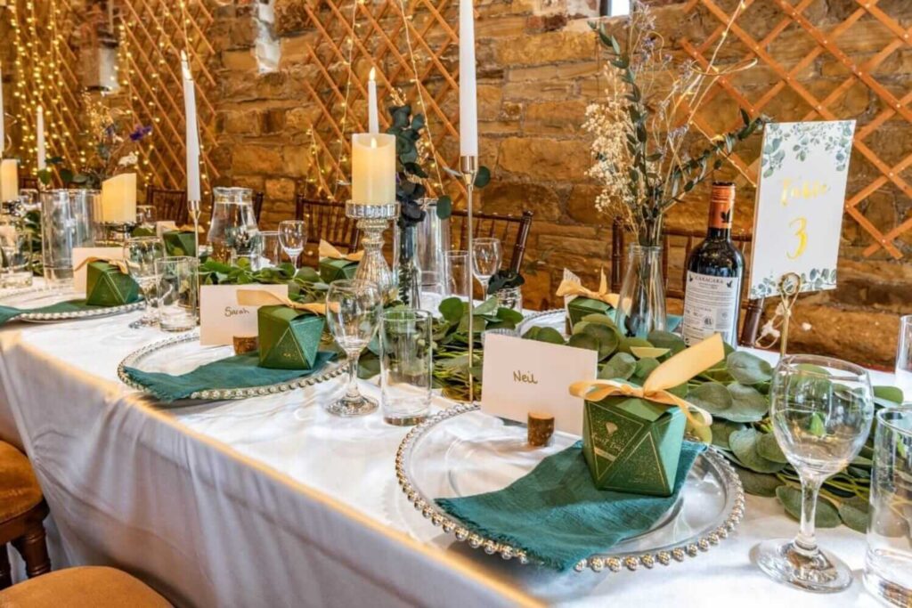 Rustic table décor with greenery runner and candles