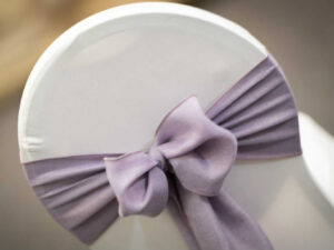 How to tie chair sashes in a neat bow on a fitted chair cover