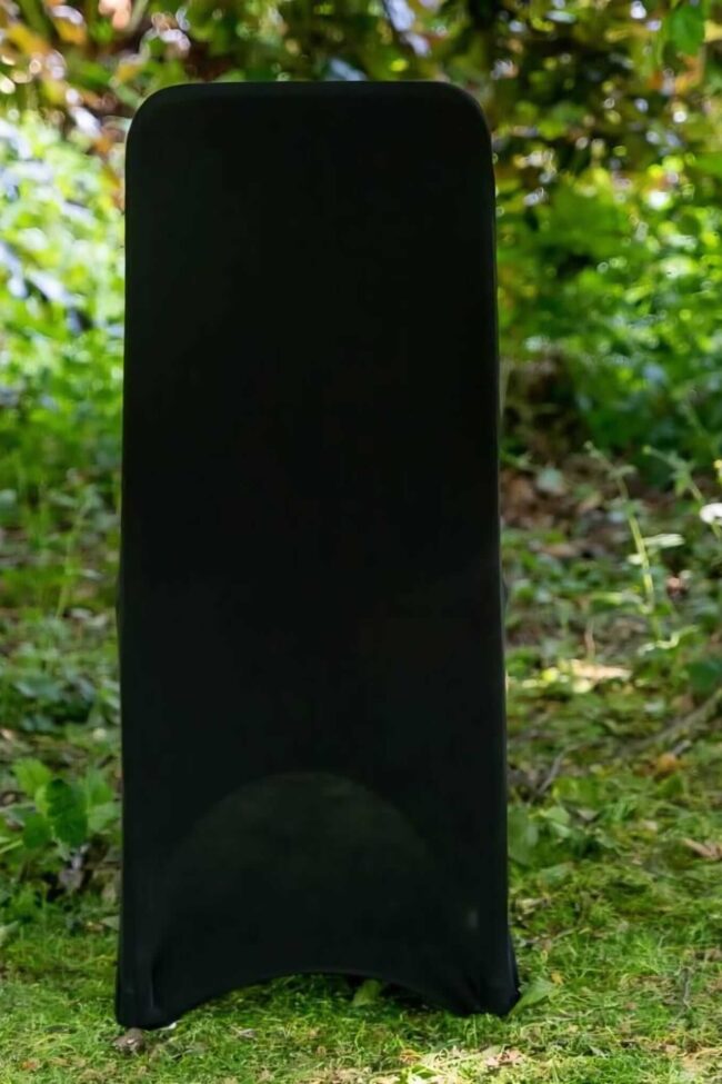 Black chair covers for hire, styled on venue chairs for an event