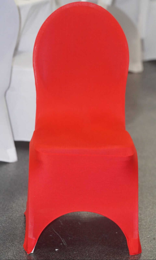 Red chair covers styled on venue chairs for an event setup