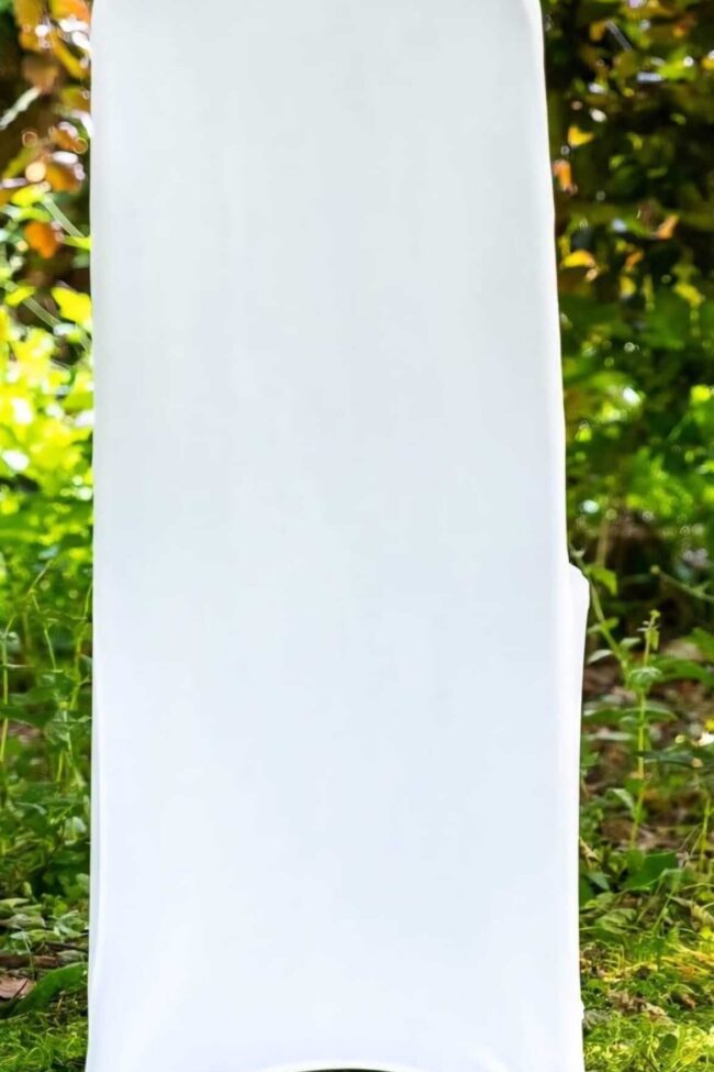 White chair covers fitted neatly on standard banquet chairs