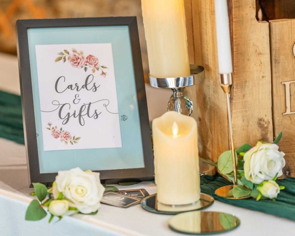 Cards and gifts sign on a wedding gift table with a post box