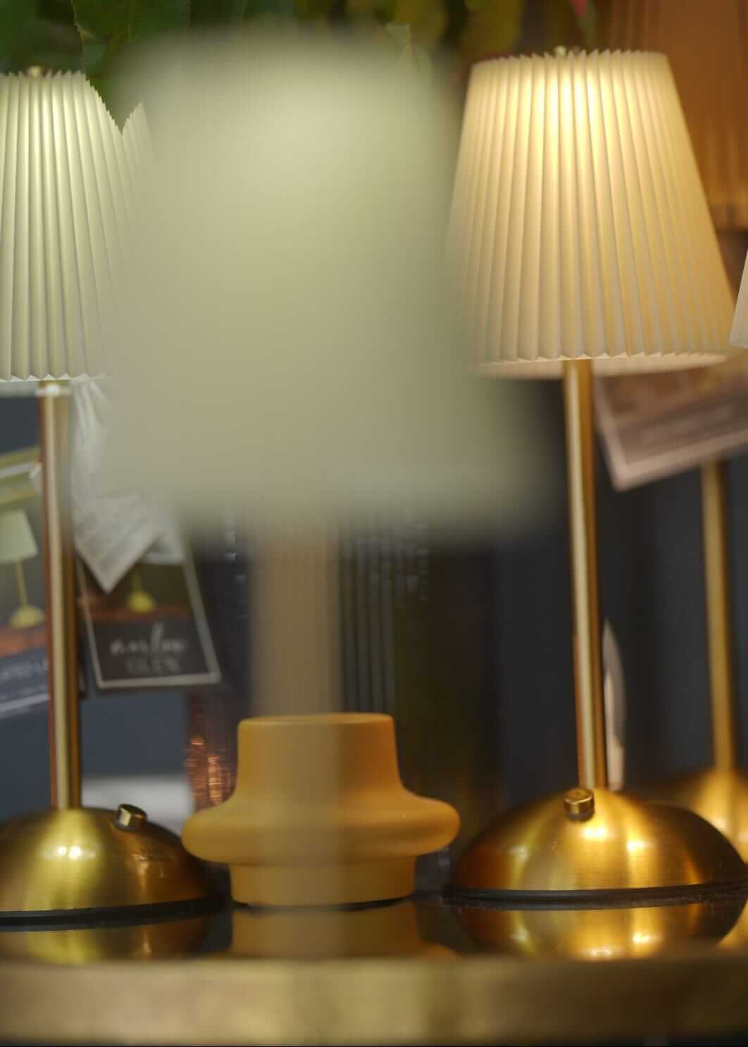 Rechargeable lamp shown as a cordless table lamp with warm glow for events