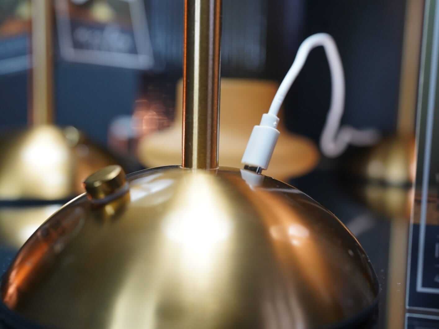 Rechargeable lamp base detail showing cordless table lighting finish