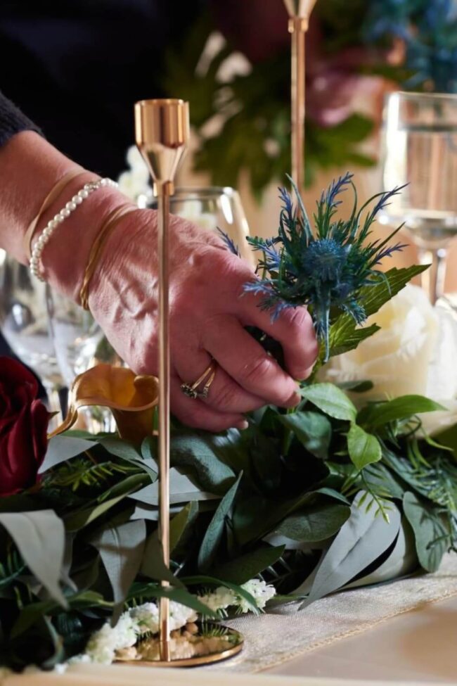 A gold taper candle holder display