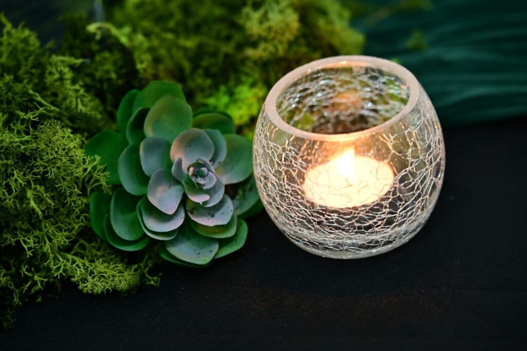 crackle glass votive candle with greenery and succulents