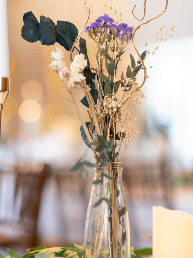 bud vase with dried florals and eucalyptus table styling