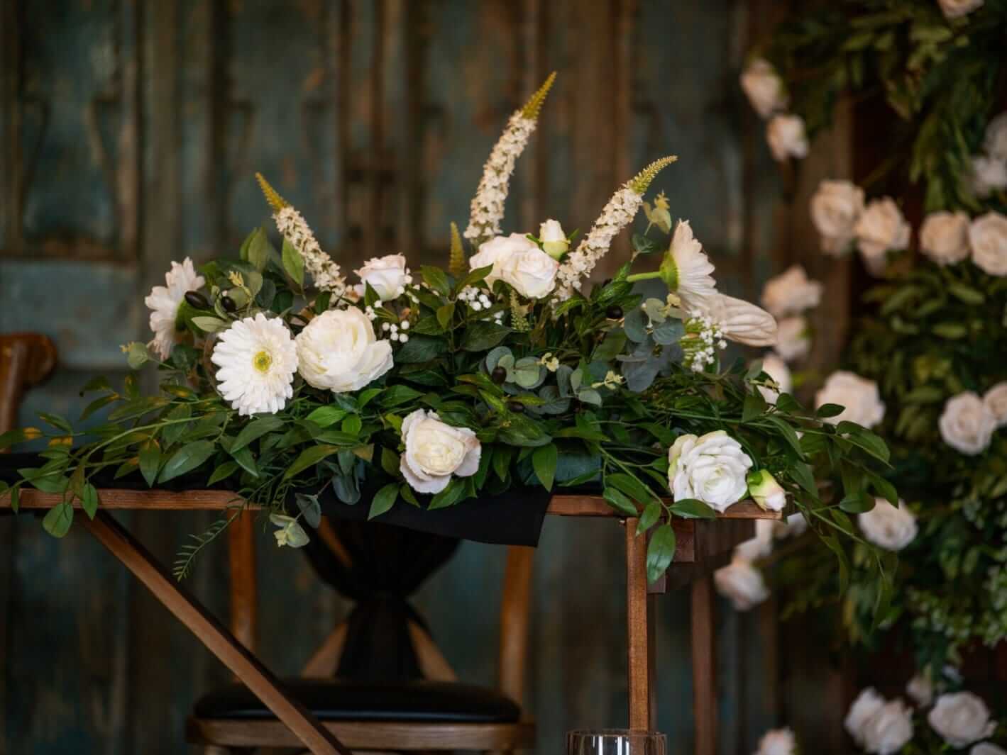 Top table artificial flowers styled as a bespoke front table arrangement