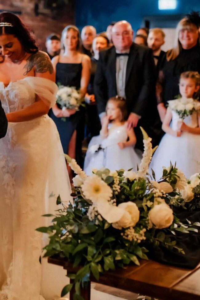 Top table flower arrangement styled for a wedding ceremony table