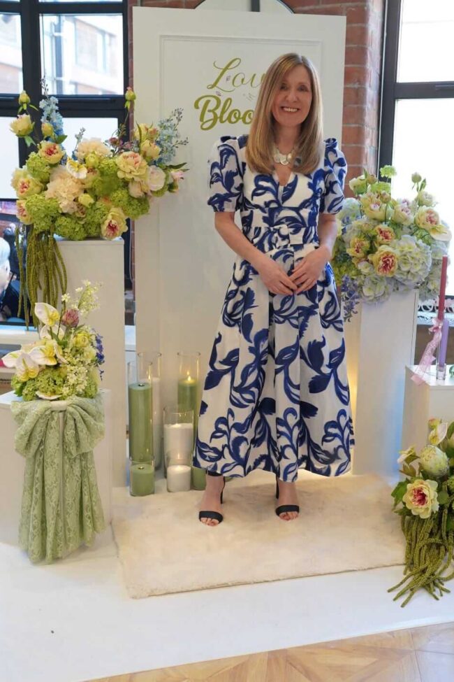 Bridal shower decorations with personalised sign board, flower columns and candles
