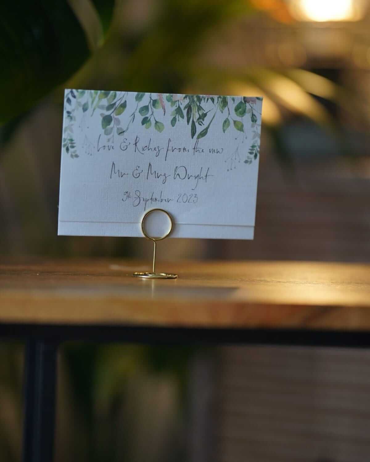 Wedding table place cards displayed for guest seating at a wedding reception