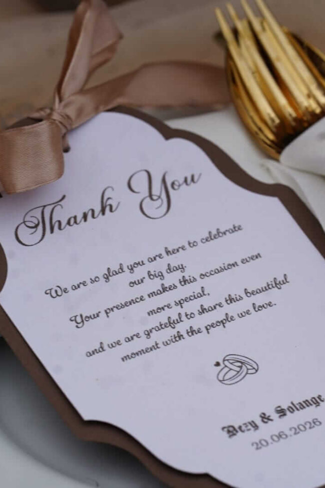 Luxury personalised stationery thank you card with ribbon styled on a wedding place setting
