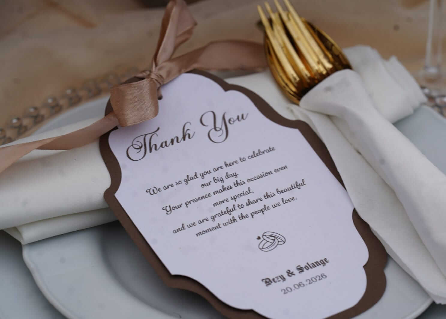 Luxury personalised stationery thank you card with ribbon styled on a wedding place setting