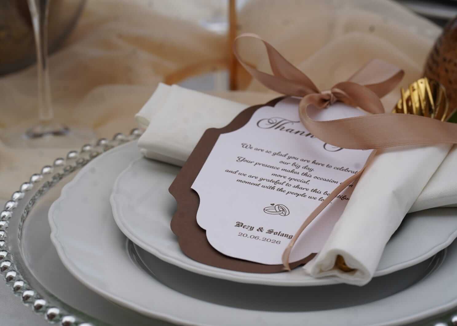Luxury personalised stationery thank you card with ribbon on an elegant wedding place setting