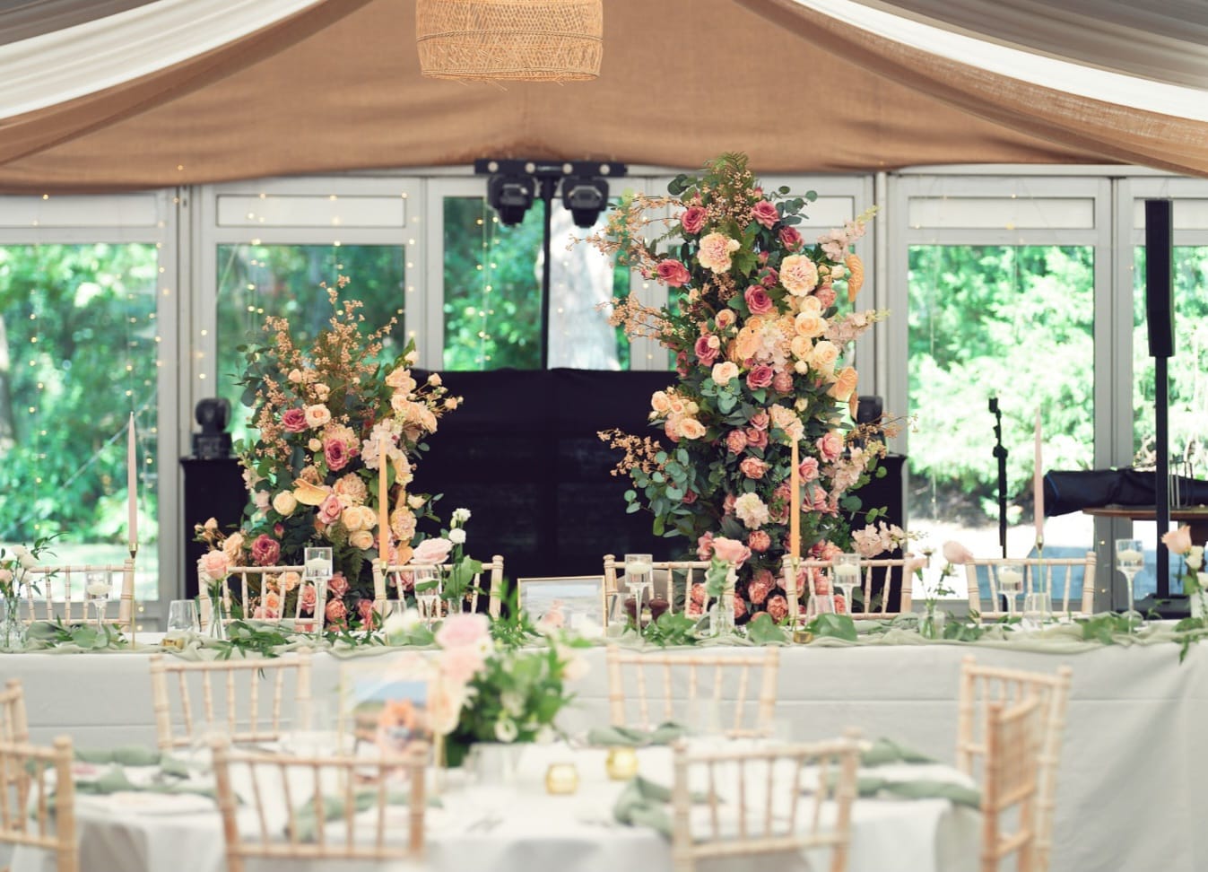 Broken floral arch hire with two staggered pillars of pink and white flowers